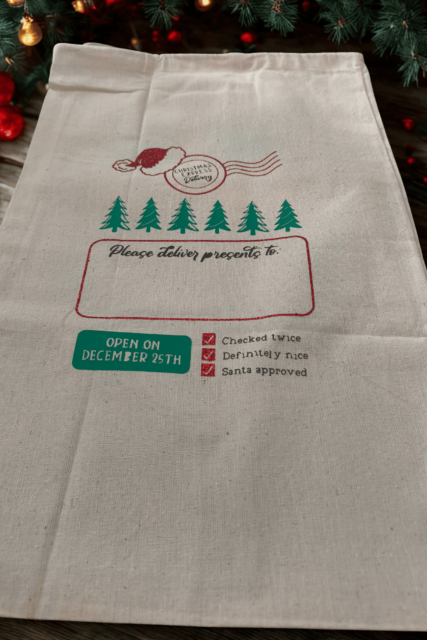 Personalised Santa sack for kids featuring holiday graphics and space for a name, perfect for Christmas gift giving.