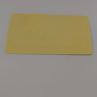 Back view of To Santa Christmas sticker showing plain yellow adhesive backing