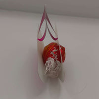 Pink metallic Diwali diya favour holding colorful sweets, perfect for celebrations and gifts.