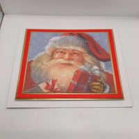 Traditional Santa Advent Calendar showing a full view of the festive artwork, featuring Father Christmas holding a present, displayed flat on a clean white backdrop.