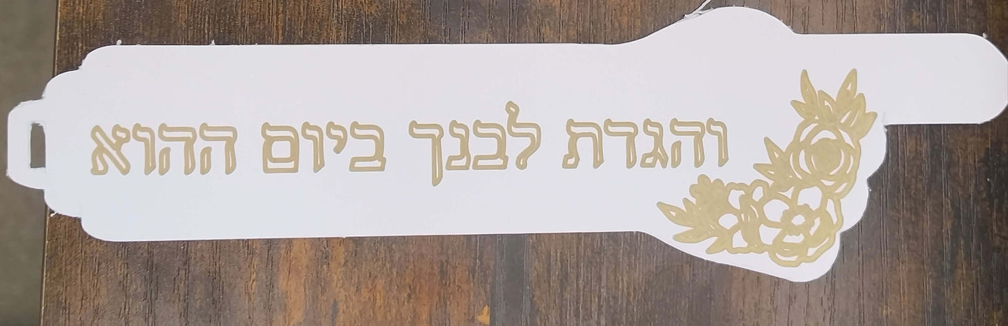 Handmade Passover bookmark featuring Hebrew verse and gold floral detail on a white background.